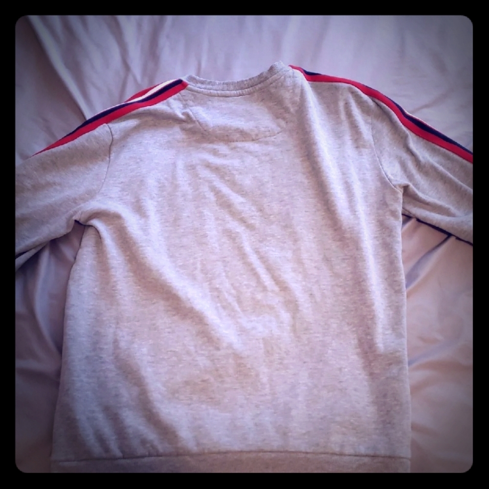 grey sweater size medium, new condition. no flaws,